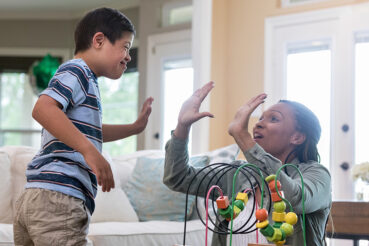 Therapist gives boy with special needs a high five