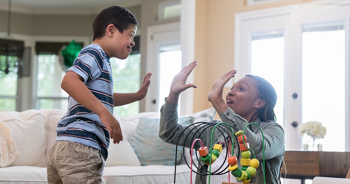 Therapist gives boy with special needs a high five