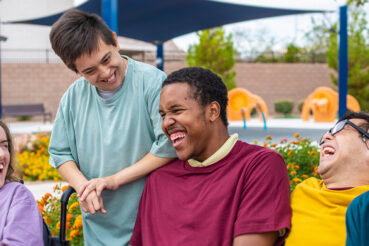 group of teens with special needs laughing