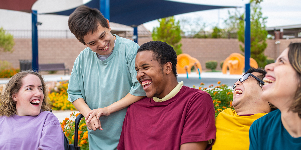 group of teens with special needs laughing