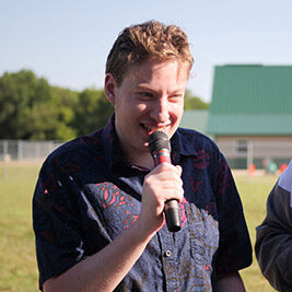 David holding a microphone