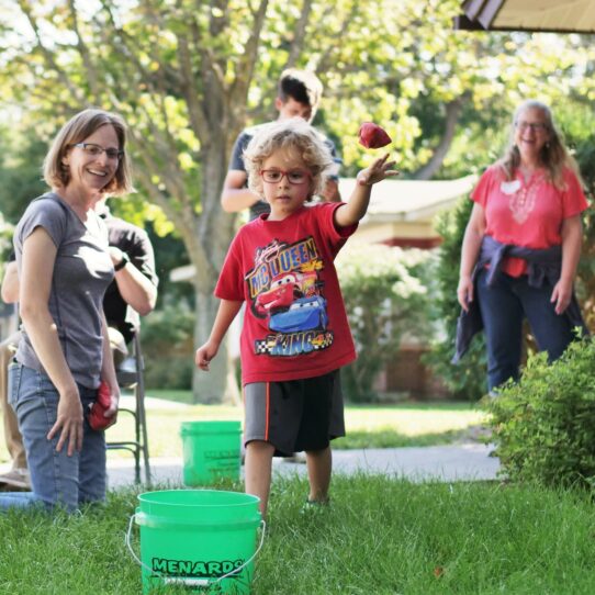 family-plays-game-outside