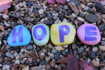 painted rocks spelling out hope