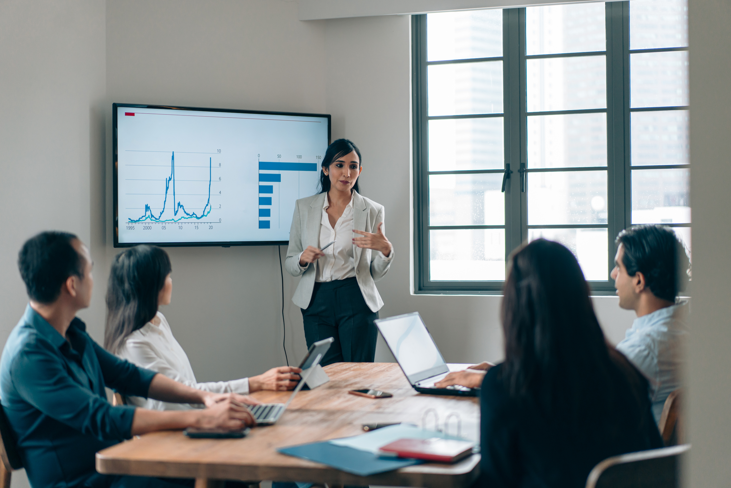 woman presenting in a business meeting