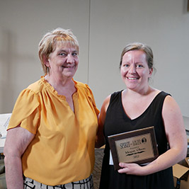 Megan receiving spirit award from Sandi Gerdes