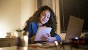 woman working from home taking notes