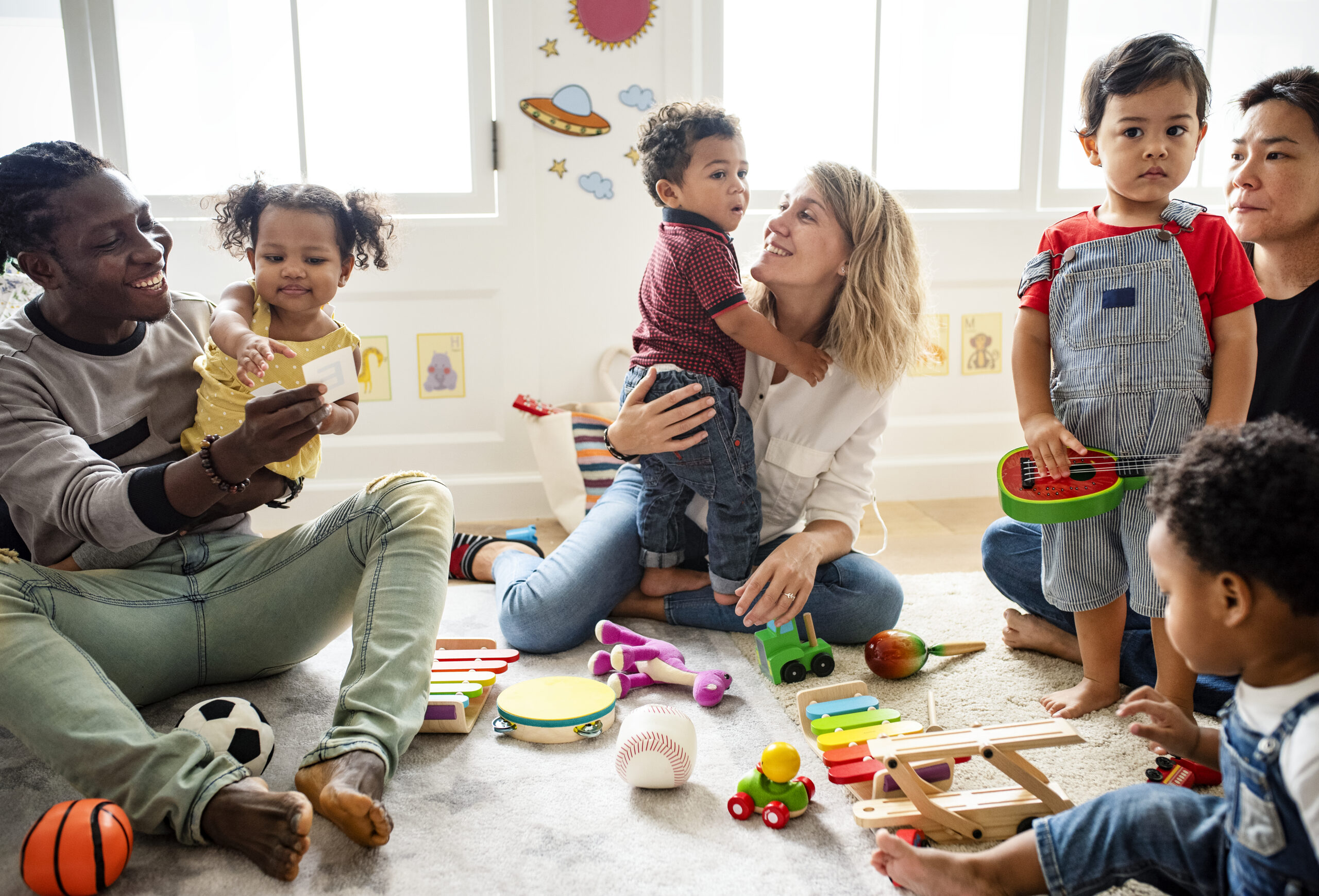 A group of families and kids play together