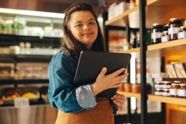 Store employee using tablet